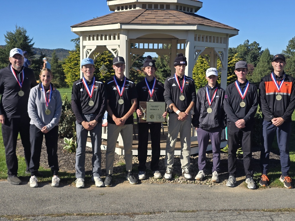 Somerset boys golf team holding the District V championship plaque
