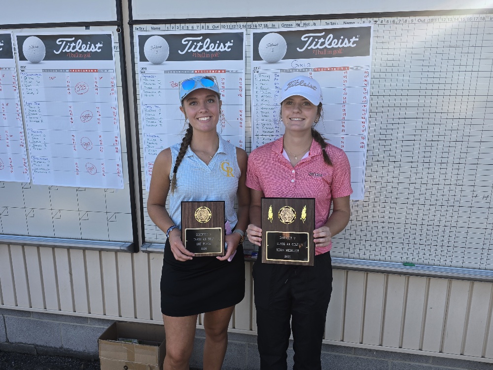 Girls individual golf champions Olivia Nichols of Rockwood and Kaydence Dufour of Chestnut Ridge holding District V awards